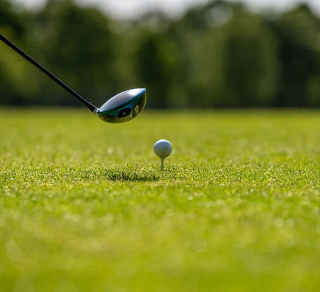 A golf club lining up a swing