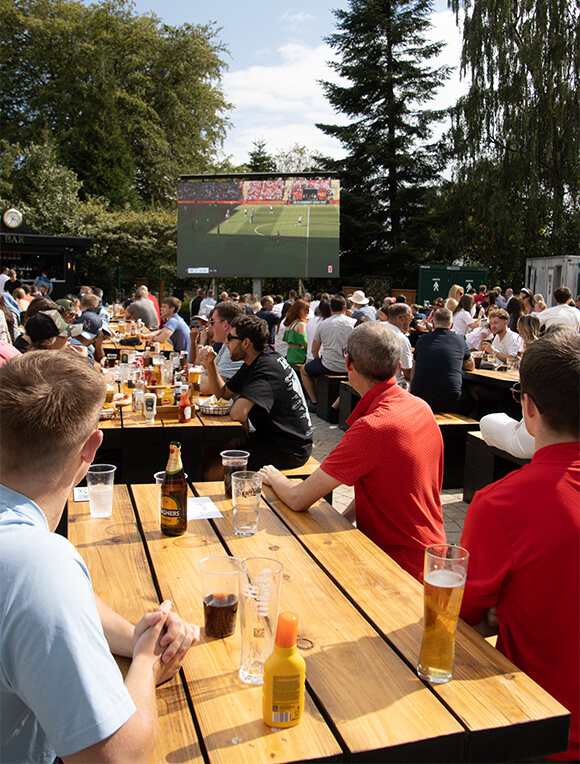 People enjoying the Fletcher's Beer Garden on a sunny day