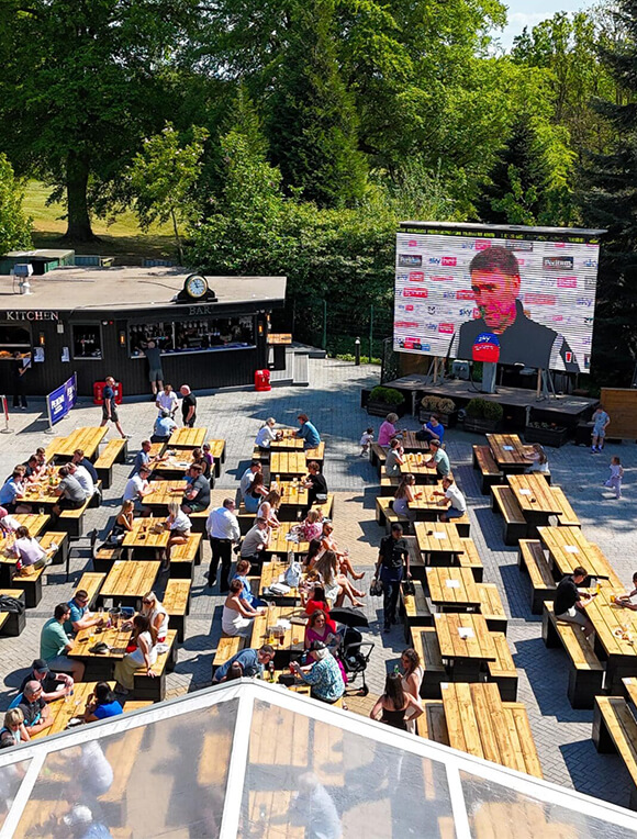People on a summers day enjoying Fletcher's beer garden